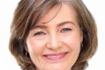 Portrait of a smiling business woman, white background